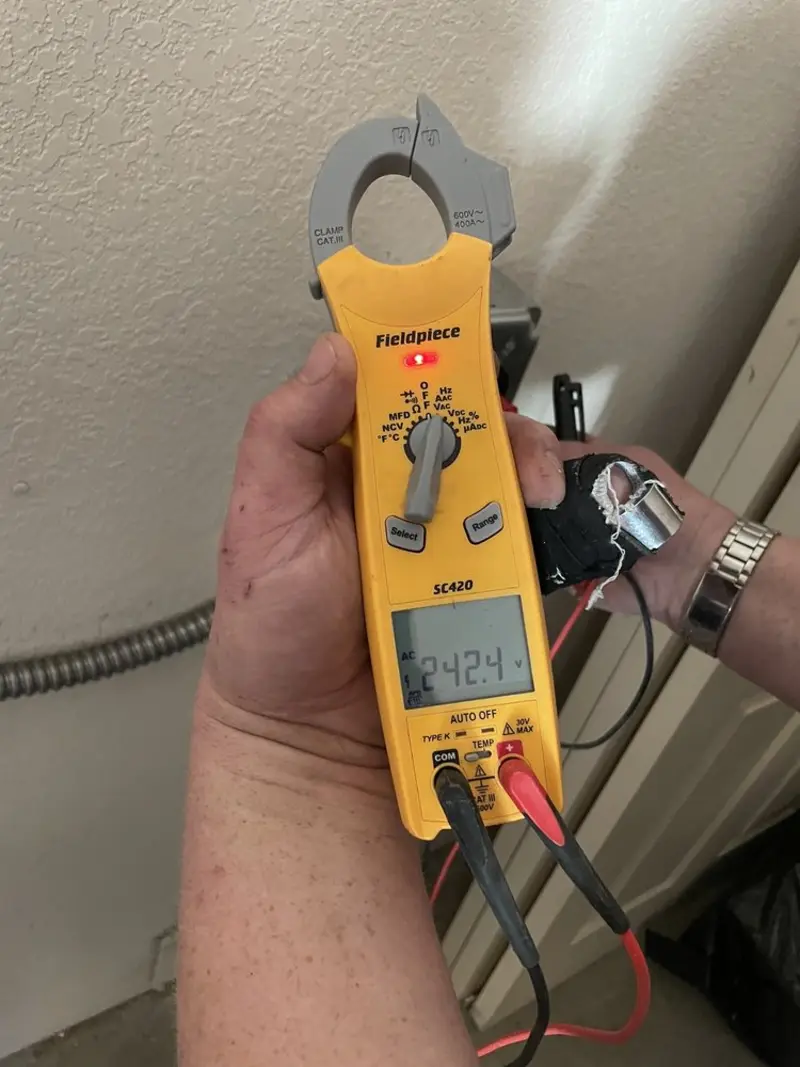 Voltage testing with clamp meter during Recessed Lighting Installation in Bogalusa